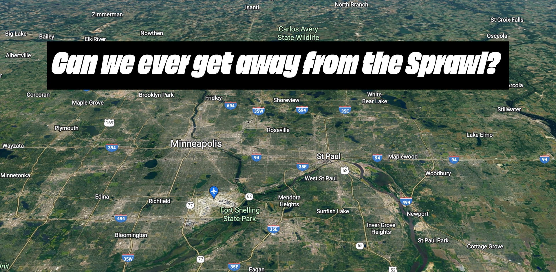 a satellite view cities and their surrounding suburbs with the text: Can we ever get away from the sprawl?