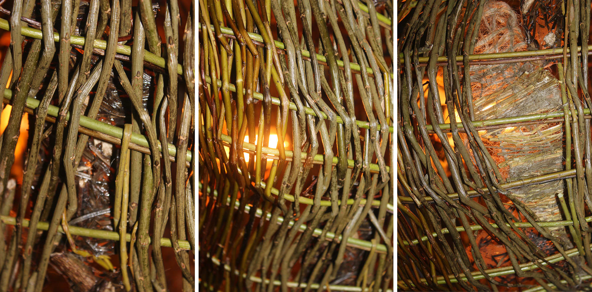 Details of willow woven lampshade lit from within with warm glow with woven flax and bio plastic details