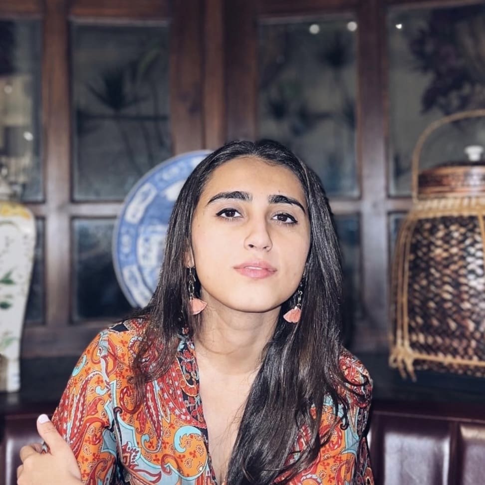 Image of a girl sitting at the table