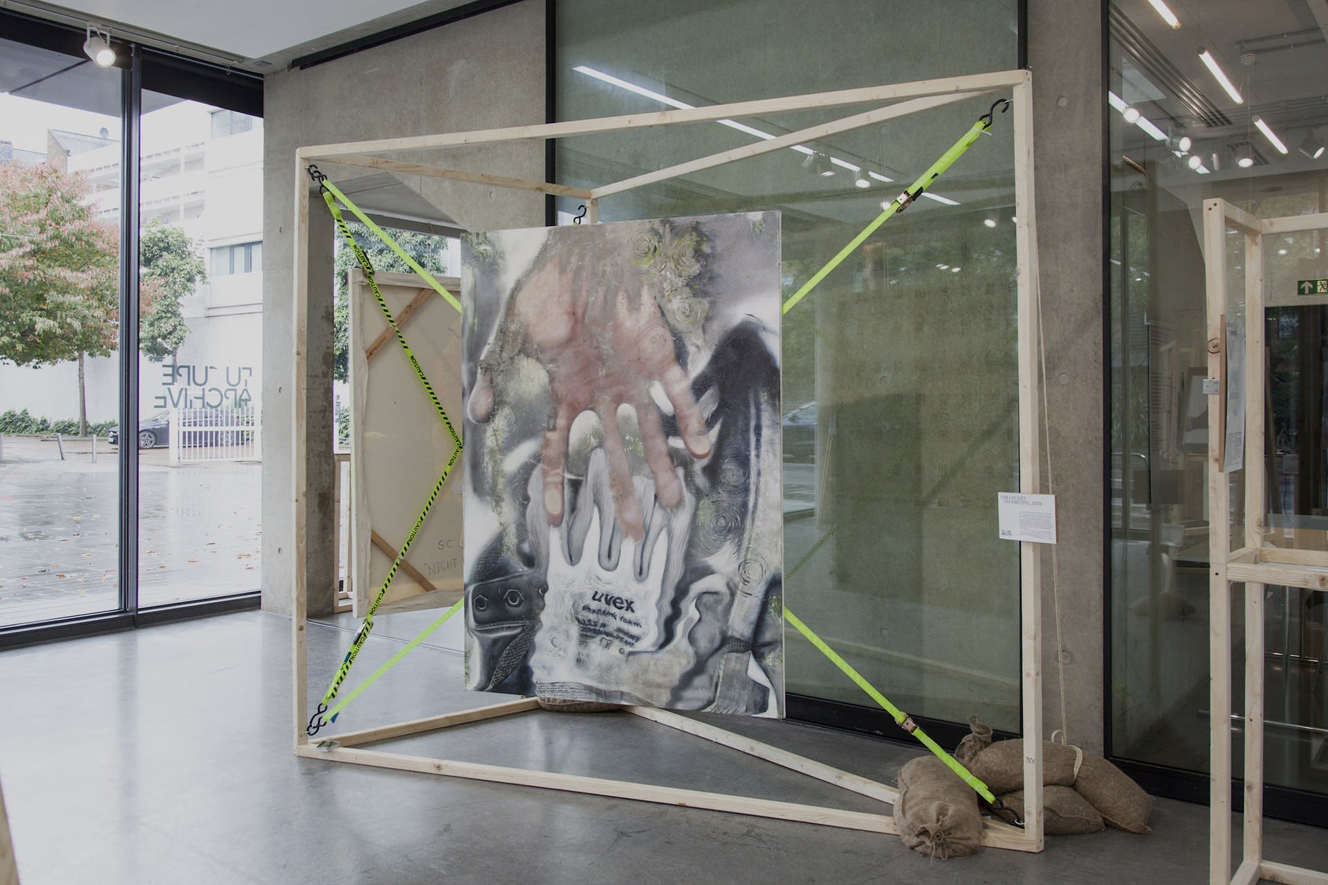 Installation at the Dyson Gallery: Royal College of Art Battersea for Future Archive group exhibition. 'Substrate' - Wood, Sandbags, Hooks, Ratchet Straps. Two Paintings (125cm x 175cm + 100cm x 150cm) September 2019