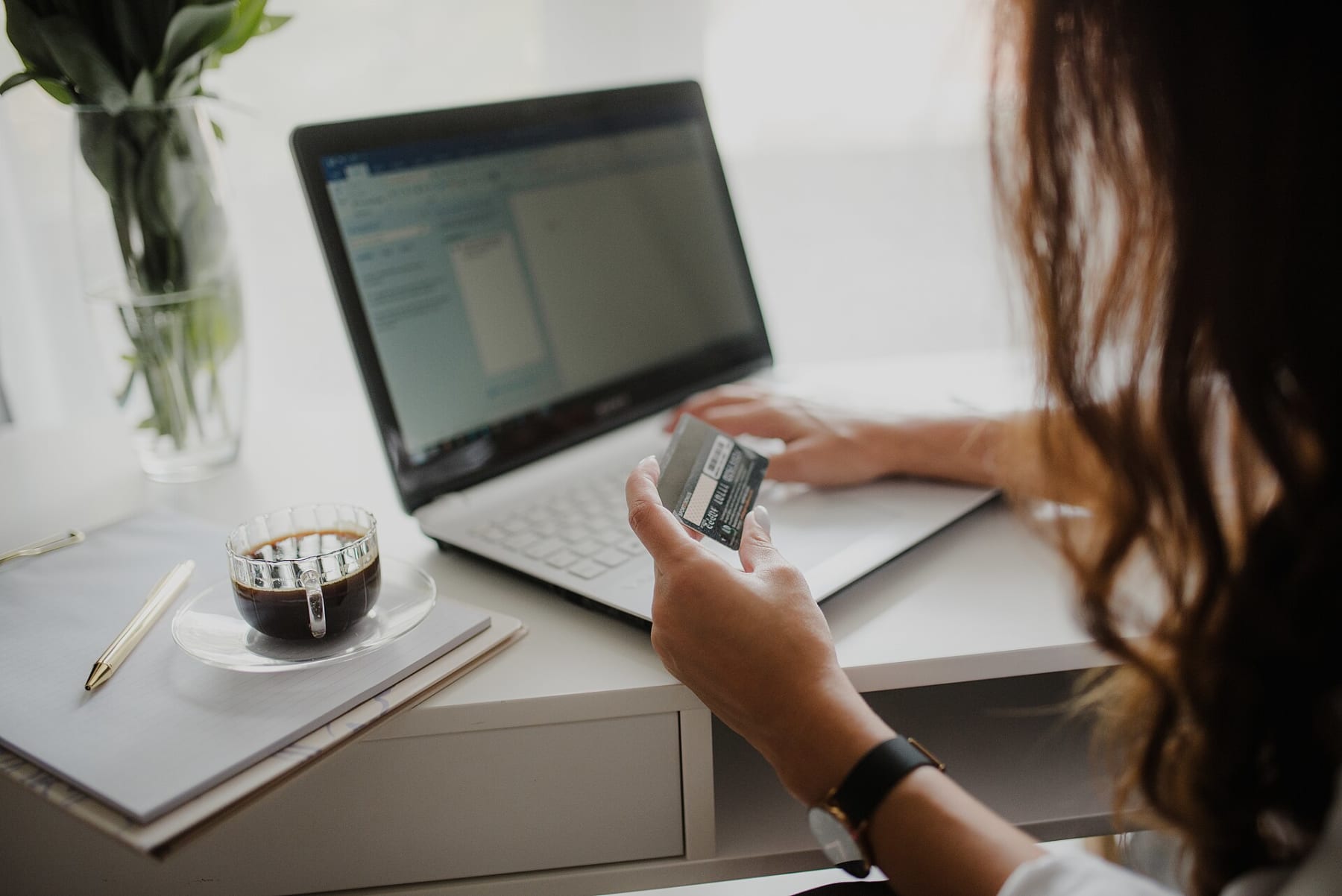 Consumer using a credit card while shopping online - representative image