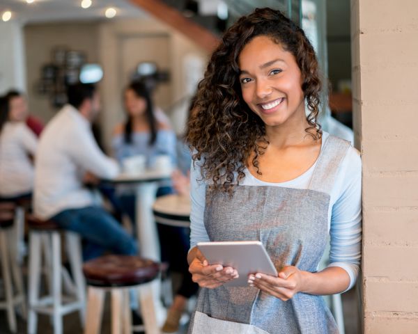 Image of waitress with tablet