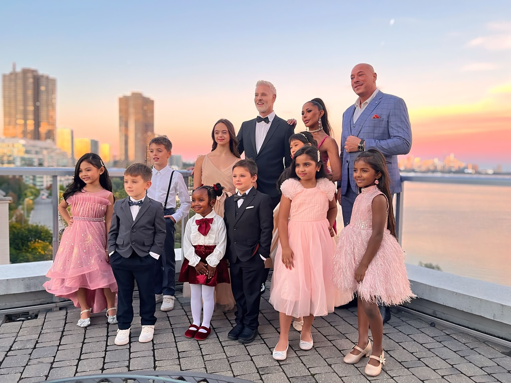 Natasha with a group of children and adults at an outdoor event