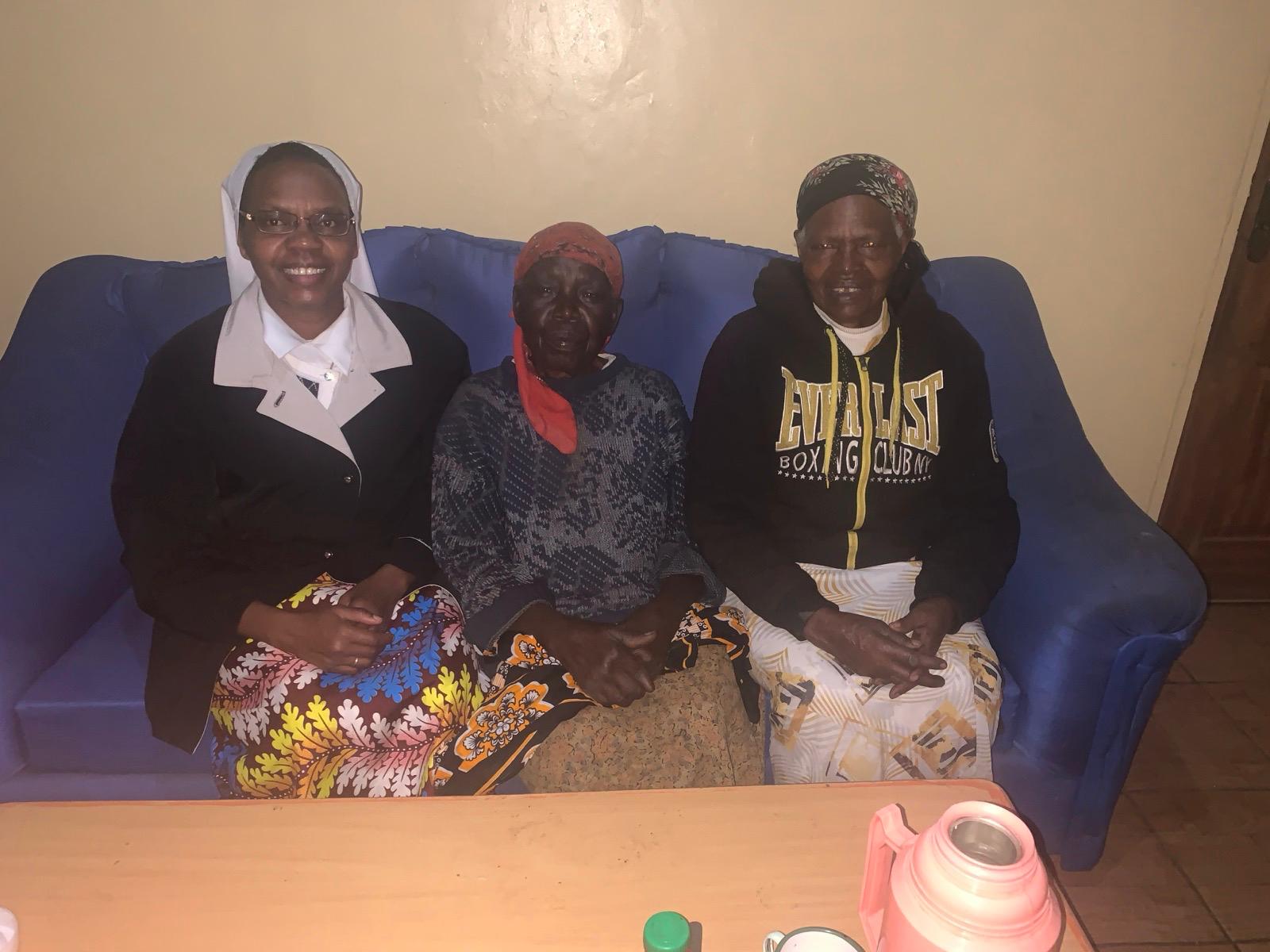 Beneficiary seated on couch