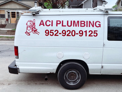 Back of a van that says ACI PLUMBING.