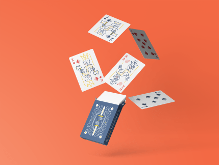 Font Awesome playing cards flying out a navy tuckbox on an orange background