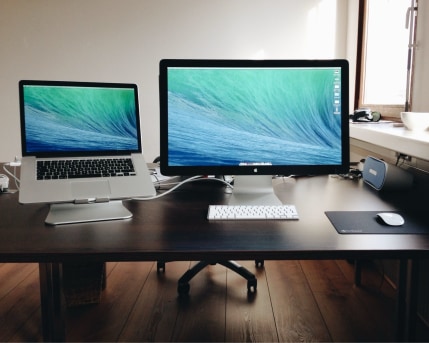 Desktop setup with a laptop and connected display