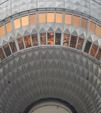 A detailed look at the windows of the Berlin TV Tower (Fernsehturm Berlin), reflecting the city below. Every window reflects another unique world.