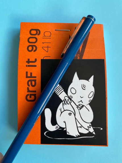 Small notebook with a felt-tip pen