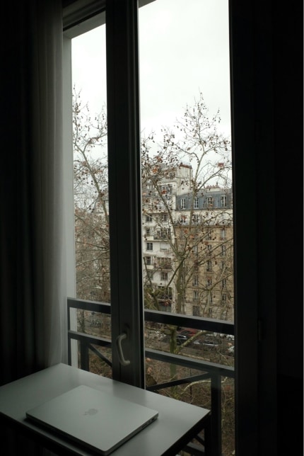 Peeking at a Paris street through my hotel window