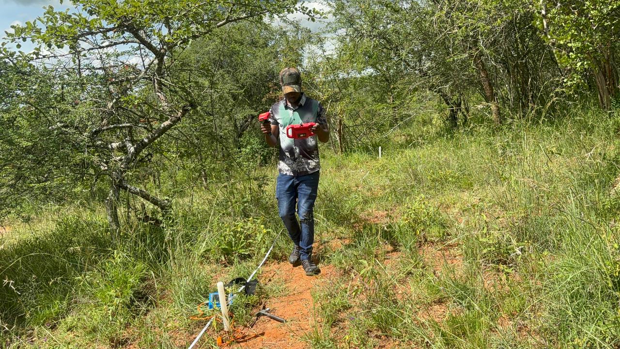 Maji Source drilling truck on a red-soil site