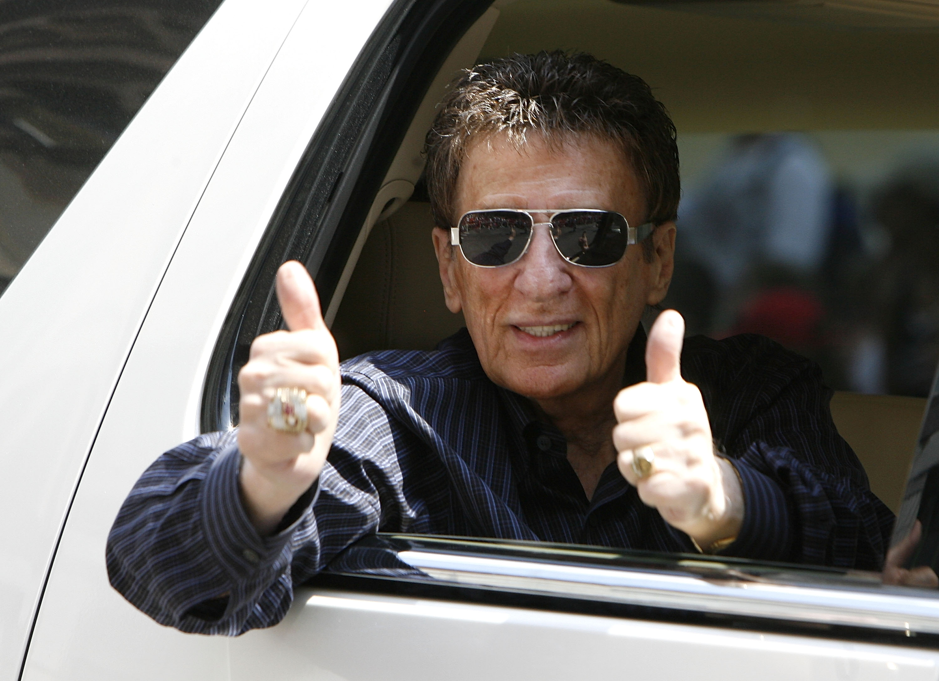 DETROIT - JUNE 06: Mike Illitch owner of the Detroit Red Wings reacts to fans during a parade to celebrate winning the 2008 Stanley Cup on June 6, 2008 in Detroit, Michigan. (Photo by Gregory Shamus/Getty Images)