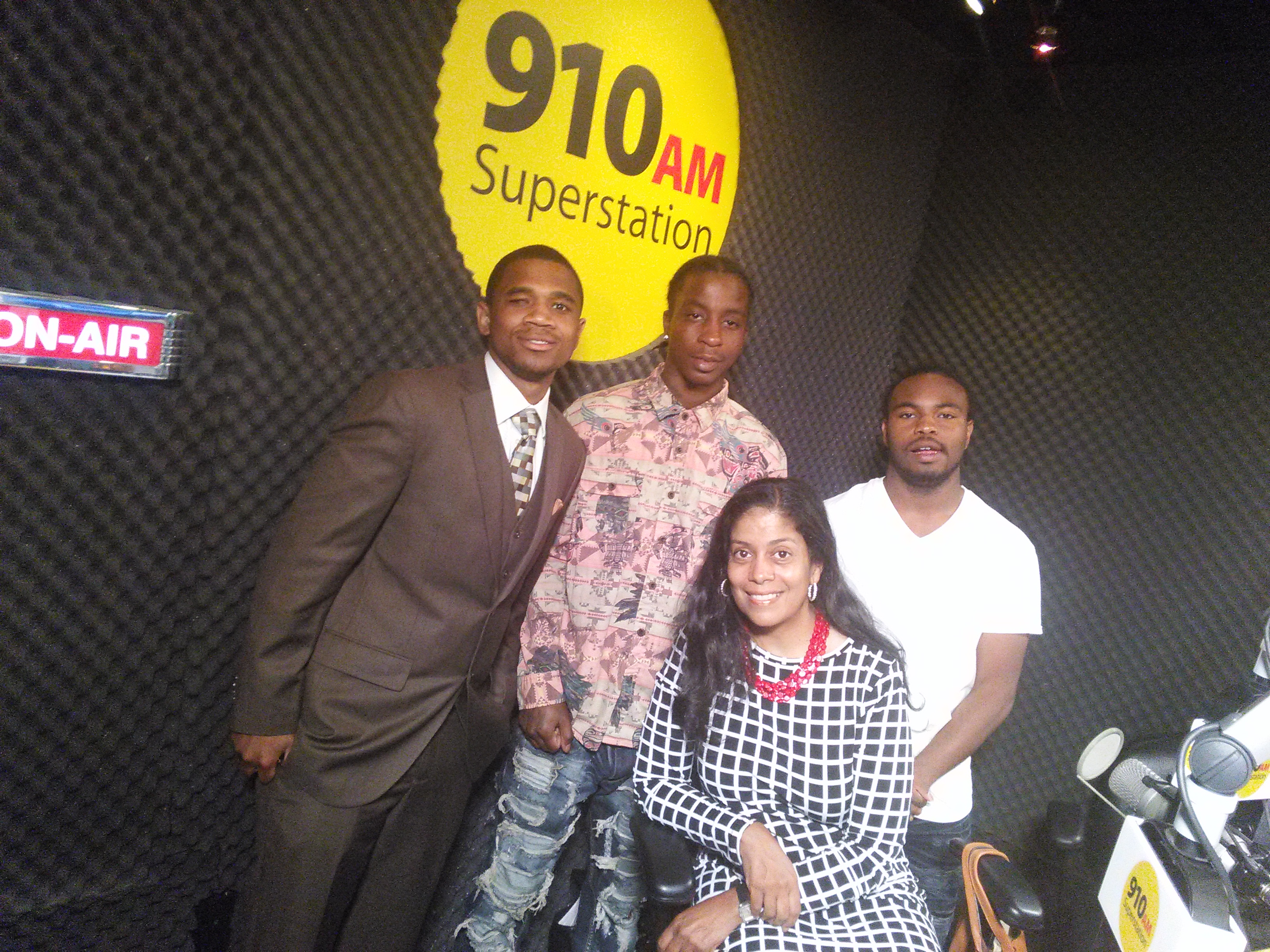 Karen Dumas (seated) with three young guests on her show, "Voices of Violence"