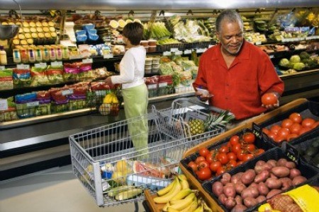 middle-aged-african-american-man-and-woman-in-grocery-store-shopping-for-produce.jpg