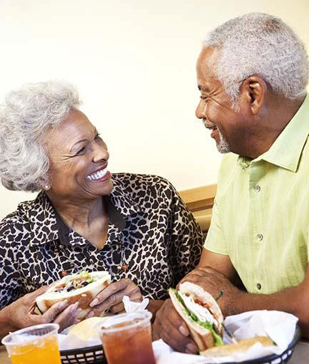 senior african_american_couple_eating_in_bld078880