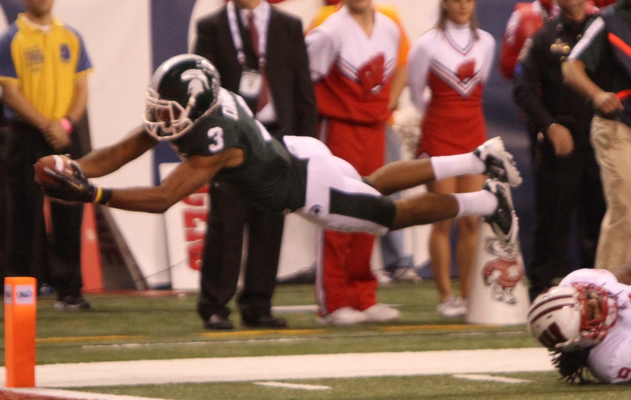 B.J. Cunningham leaps into the endzone.