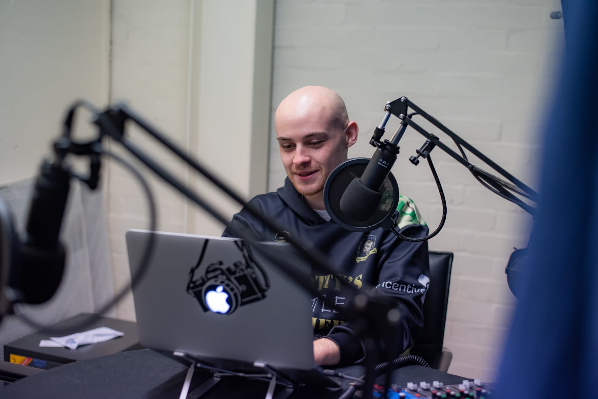 Ben from the Creative team recording a podcast for Scotty's
