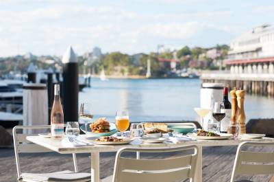 A dinner table with views of Sydney Harbour