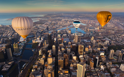 Hot air balloons flying over Melbourne city