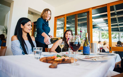 contentious character women having lunch and wine