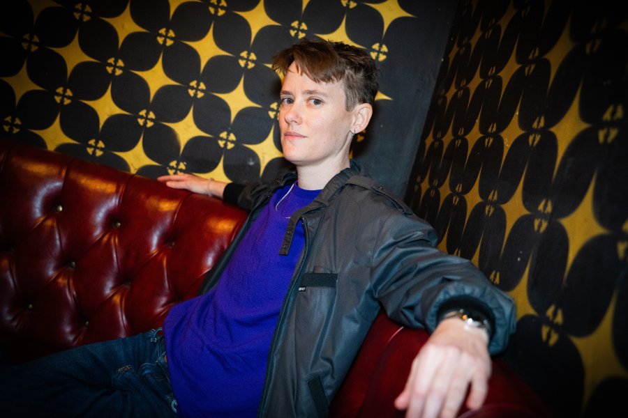 Miranda Perry sitting in a booth