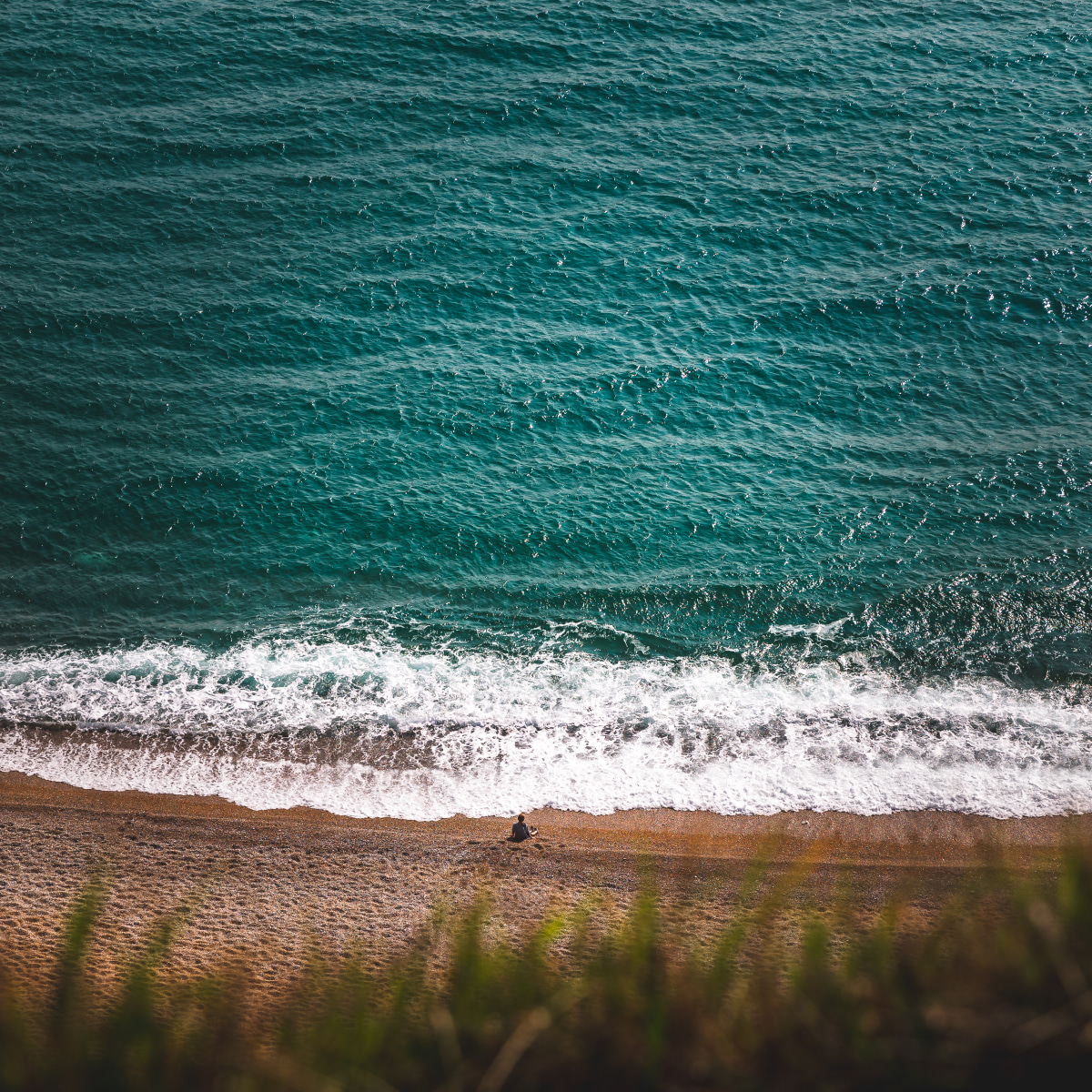 A kid Enjoying the oceans view.