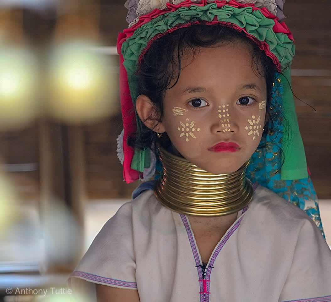 Children and women in ancient Myanmar tribe wear brass rings and