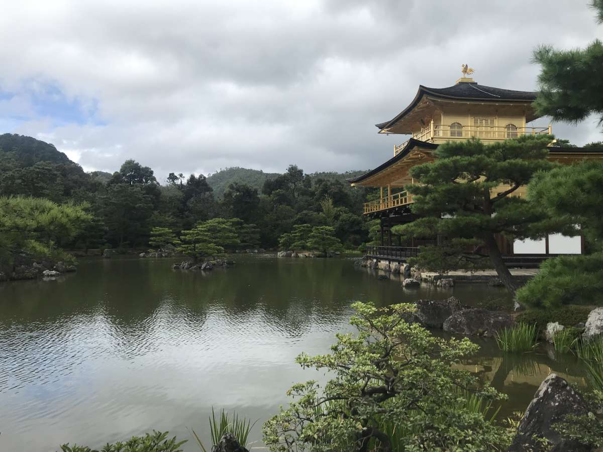 Kinkaku-ji is a Zen temple located north of Kyoto, easily recognizable because it is almost entirely covered with real gold leaves. The temple was originally the villa of the Ashikaga shogun and overlooks a large pond.