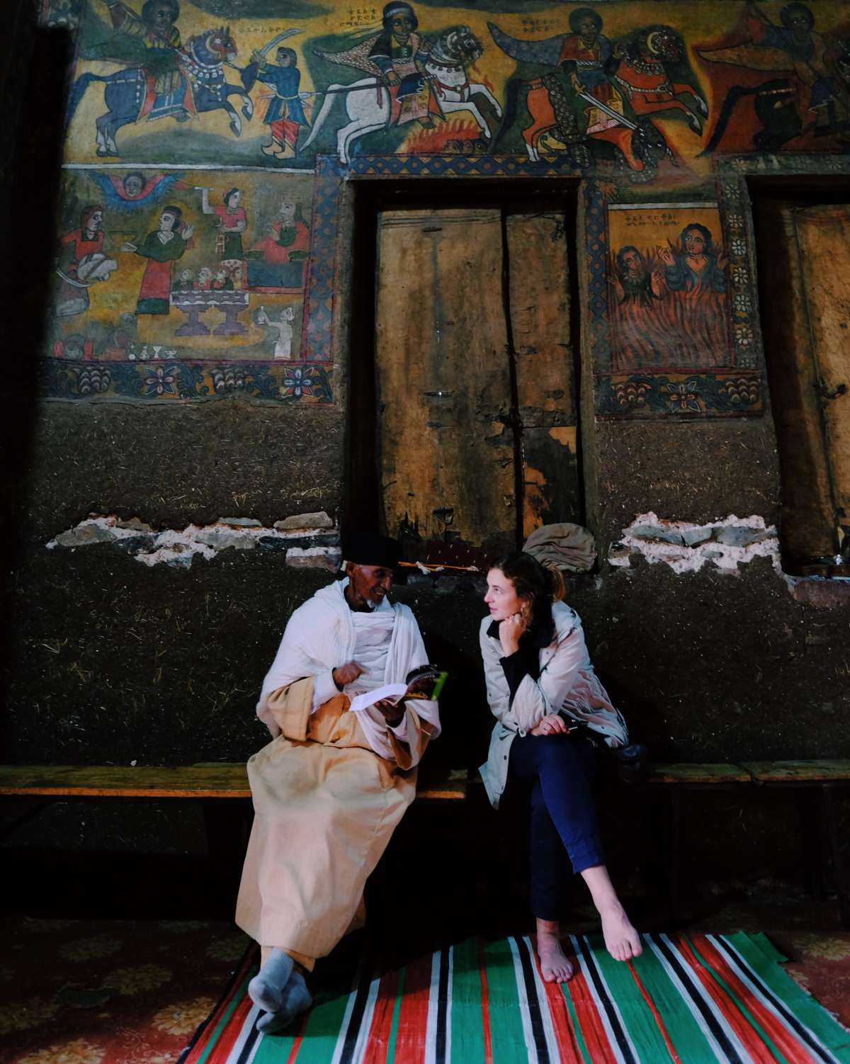 A monk browses through a guide book