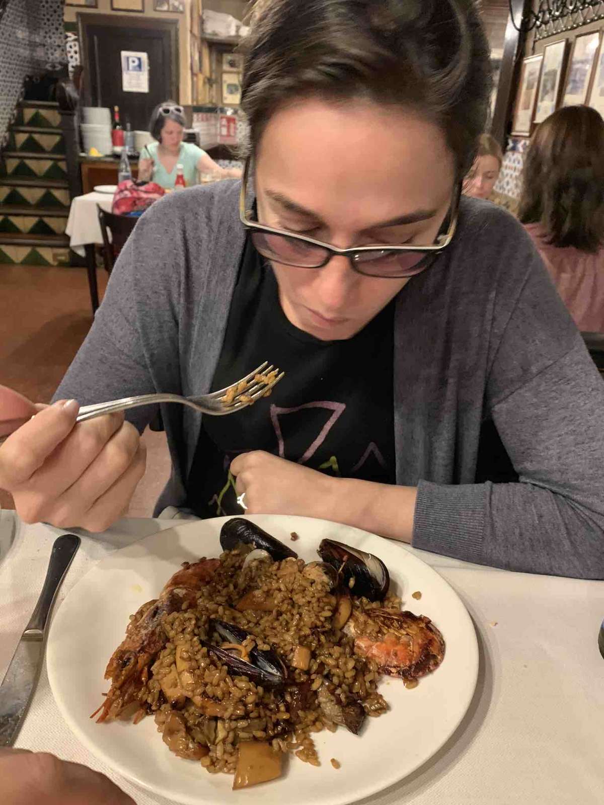 My wife eating Paella