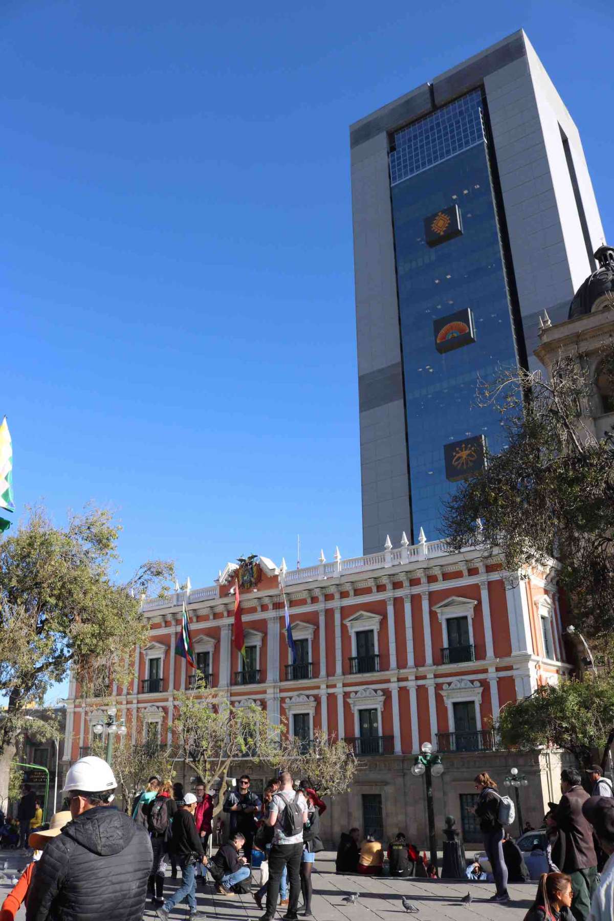 The pink building is the former government palace where the president used to rule the country. There are plans to develop it into a museum. The tall building behind it is the recently built new government palace.