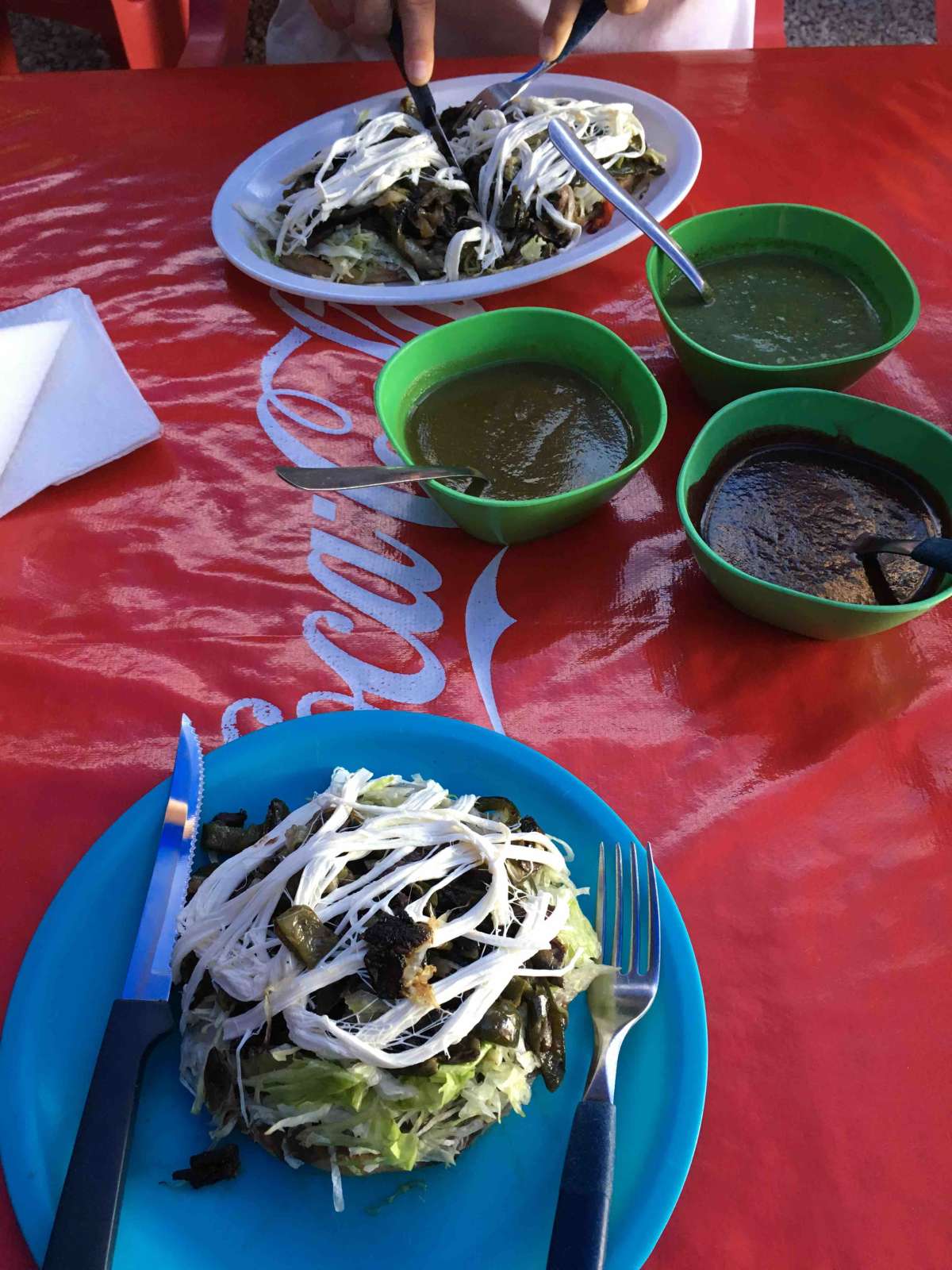 Huarachas from street vendor in Tulum! It has grilled veggies, salad, 3 different salsa sauce and price of special Mexican cheese! Huaraches is a type of bread the are making just like tacos But thicker.