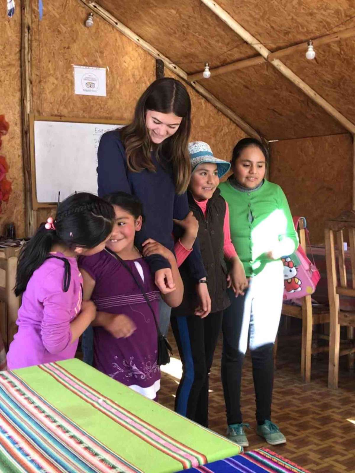 UpClose Bolivia volunteer, Elena from the US, with local school children that come to Colibri for English lessons.