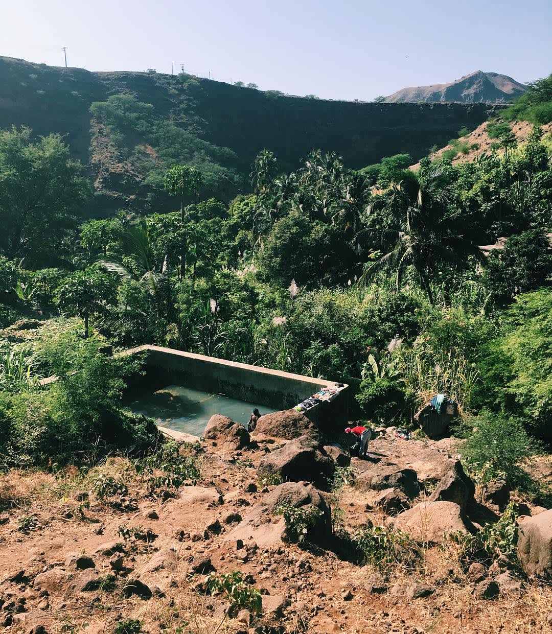 On our hike through the valley near Cidade Velha, we came across lots of banana \x26 baobab trees and somtimes, we spotted a small washing place, used to take a \x27banho\x27 and wash clothes.