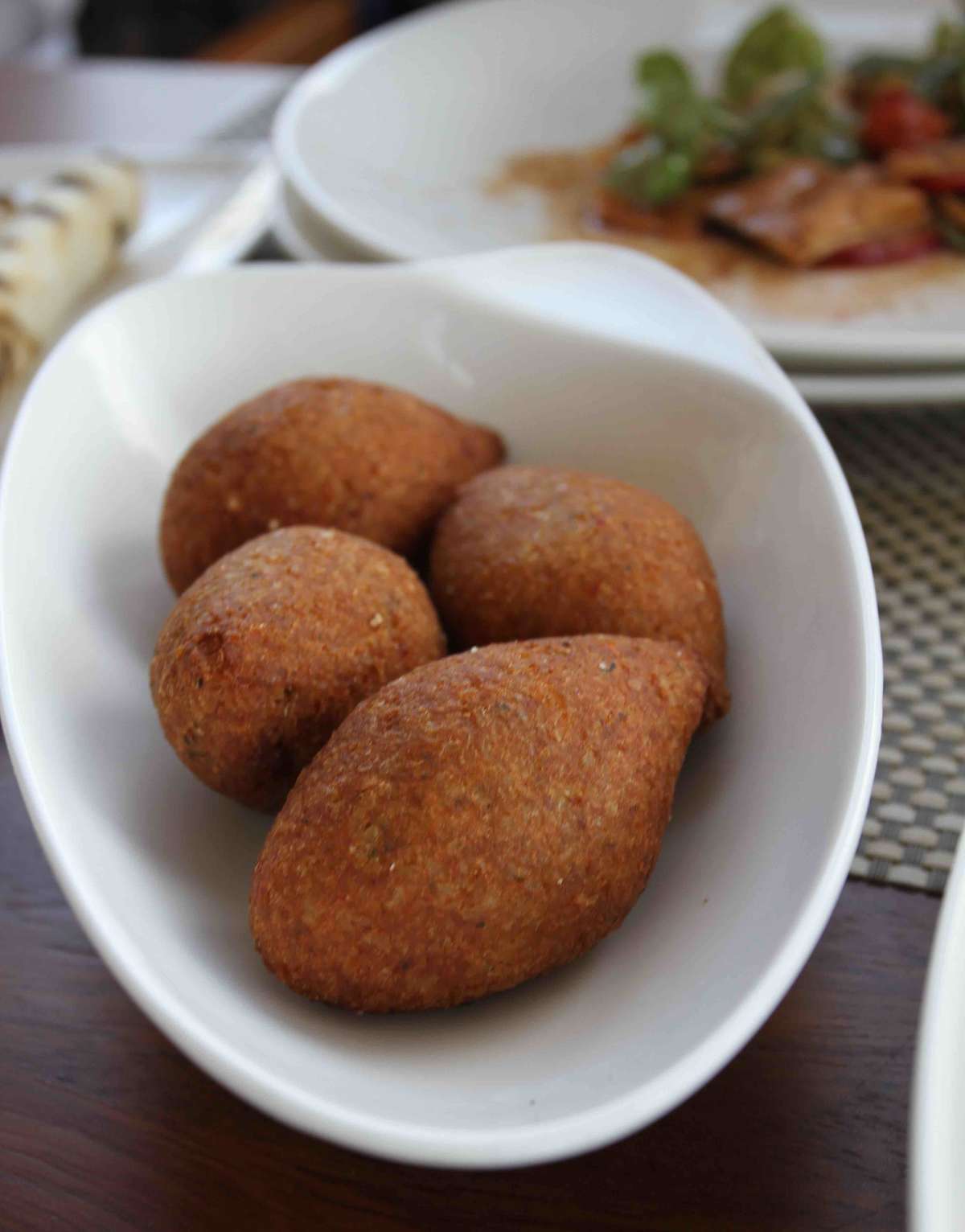 Kibbeh - bulgur flour filled with ground lamb and spices then deep fried
