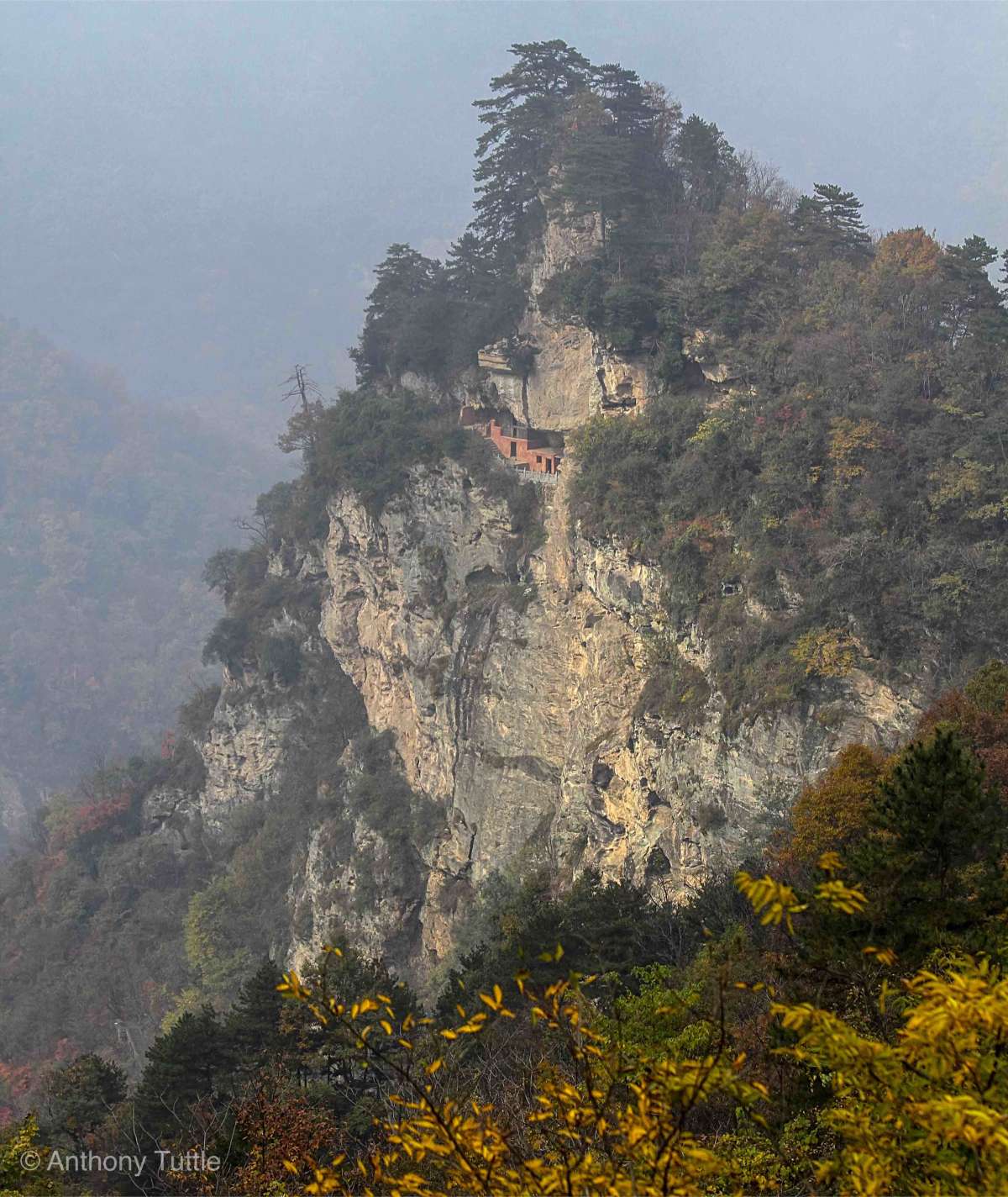 A temple suspended from the side of a cliff