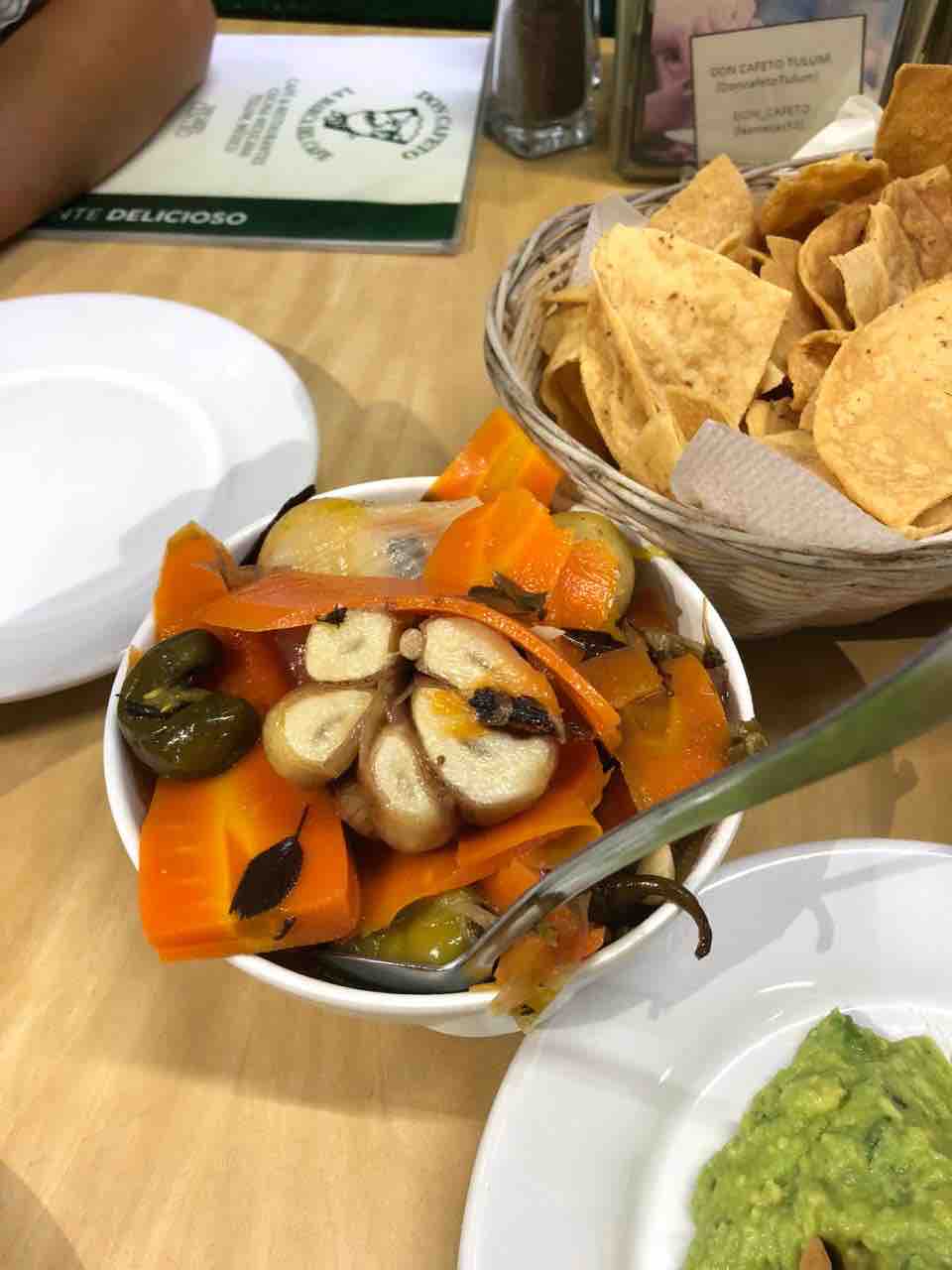 Pickled garlic, carrots and whatever you see! Picante attention. Restaurant is Don Cafeto and it’s pretty popular.
