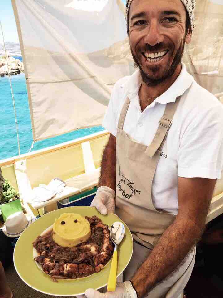 Our Captain Dimitri shows off the food he cooked for everyone.