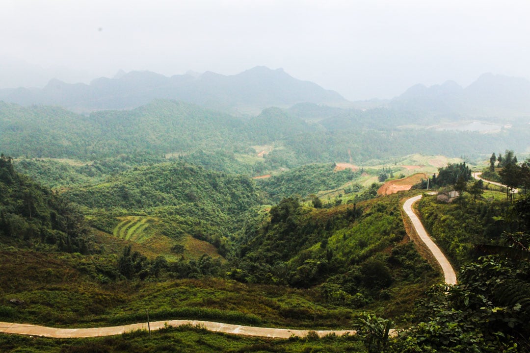 Tiny beautiful road among lush mountains.