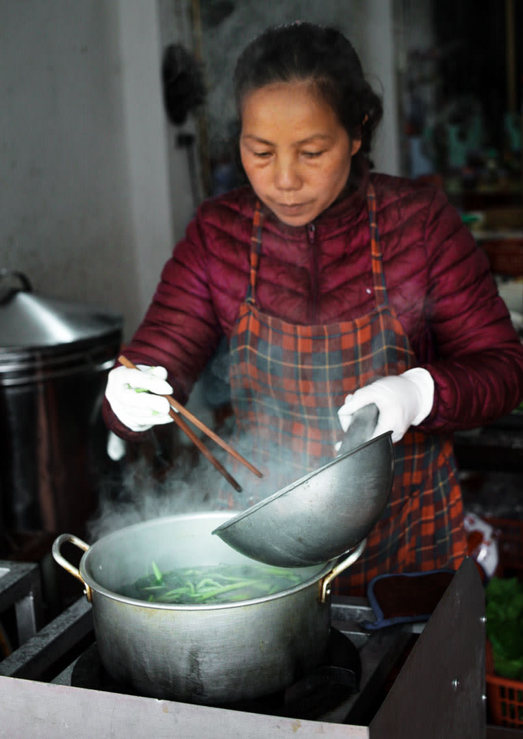 Vietnmese woman cooking a delicious soap