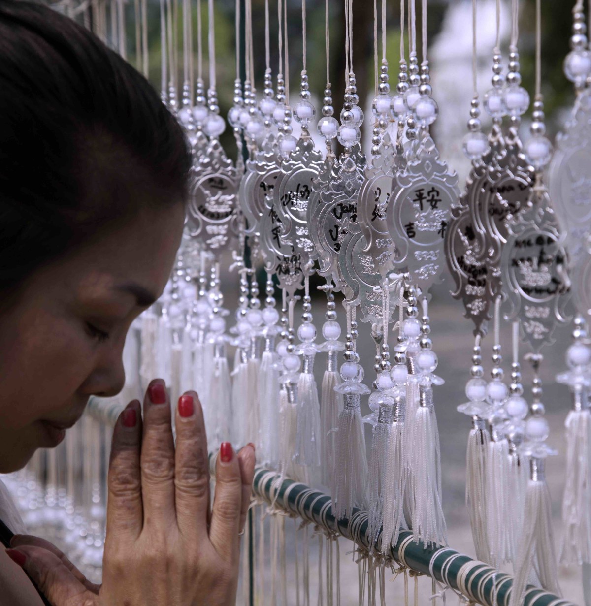 Saying a prayer at the wish makers