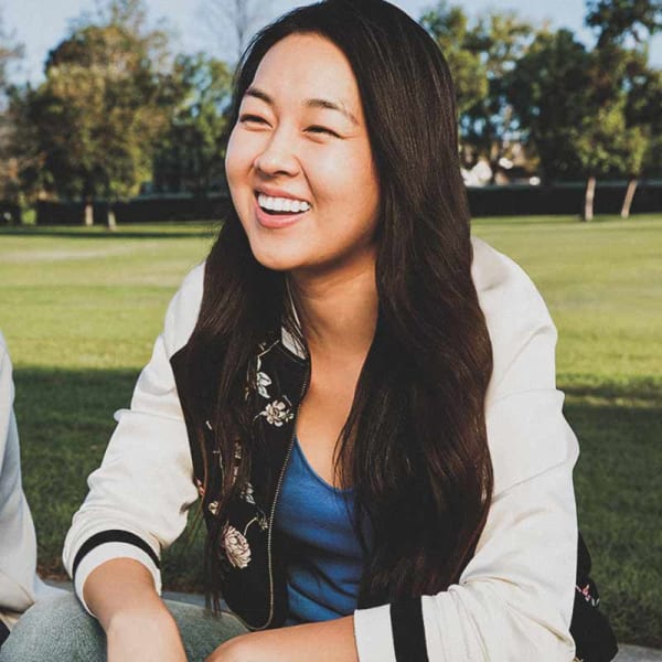 Teenager wearing the nearly invisible Invisalign Teen aligner tray