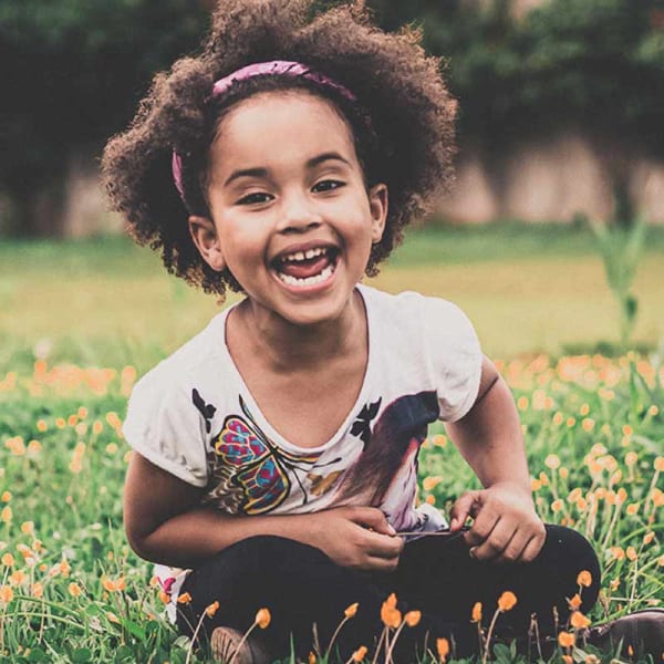 Smiling young child with a palate expander