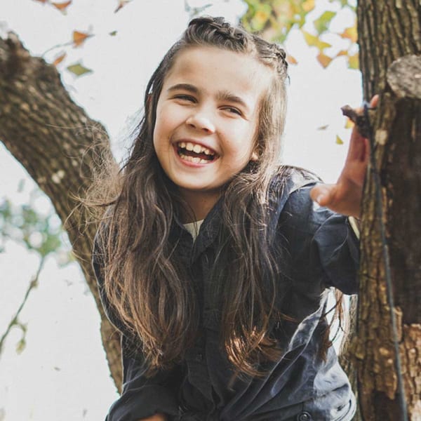 Smiling child with lower jaw needing expanded