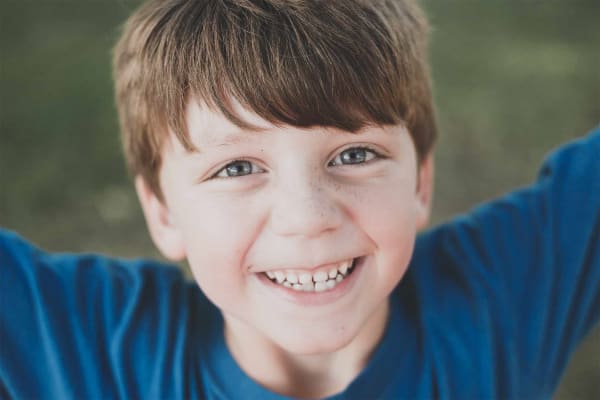 Child smiling during rapid palatal expander treatment