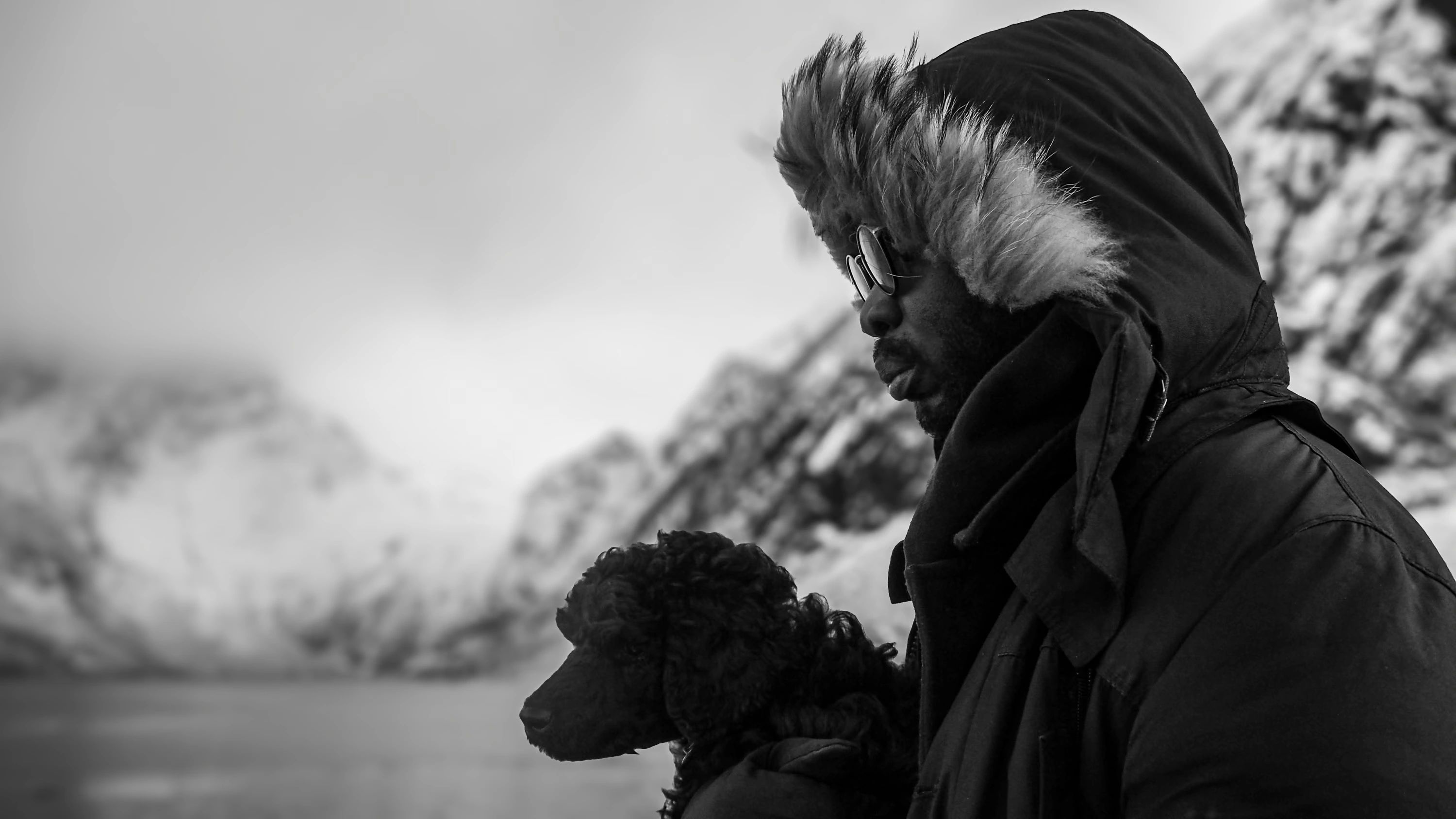 a black man with a dog