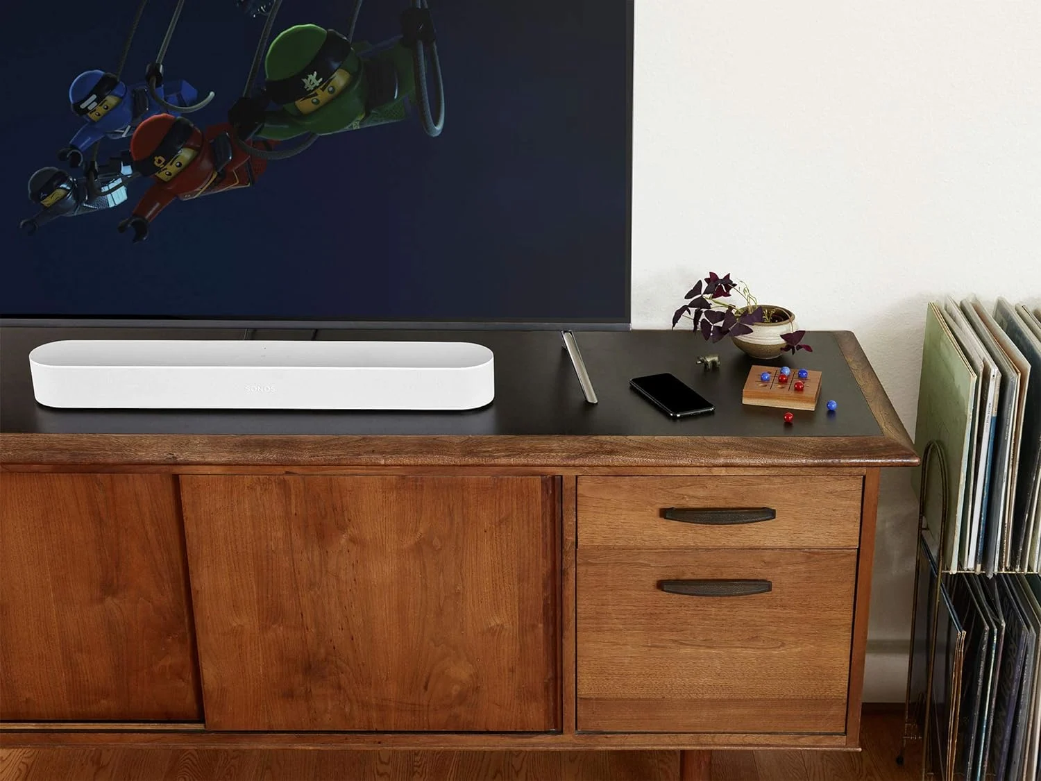a white soundbar on an entertainment console