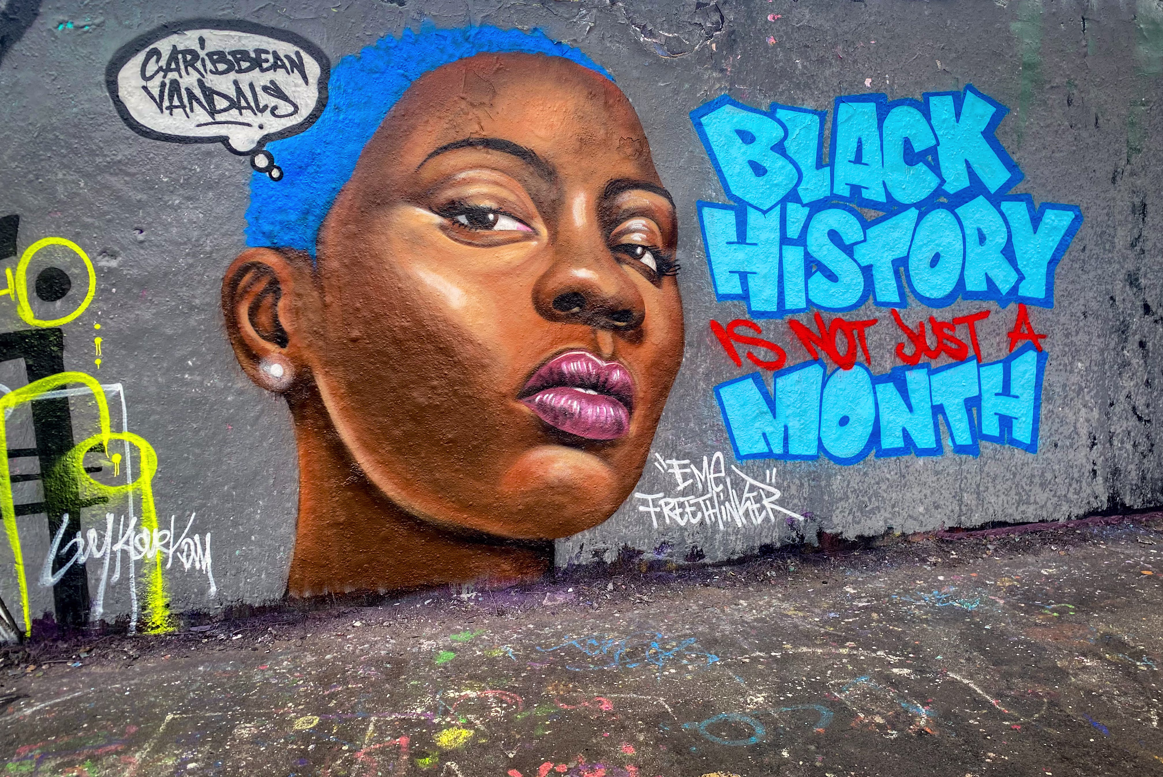 graffiti of a Black woman with blue hair