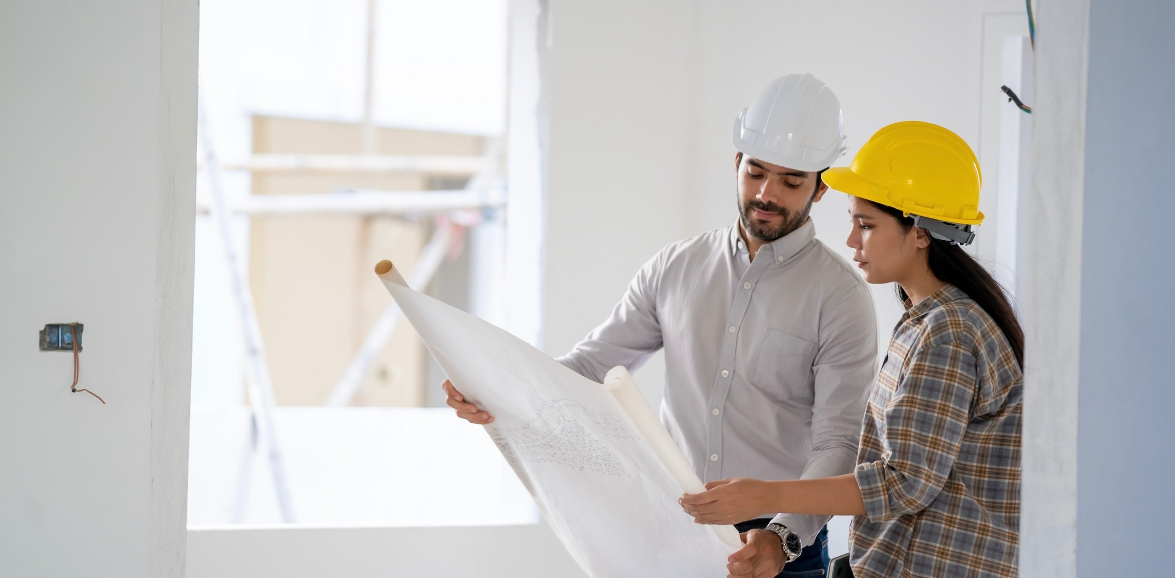 Two people renovating a home