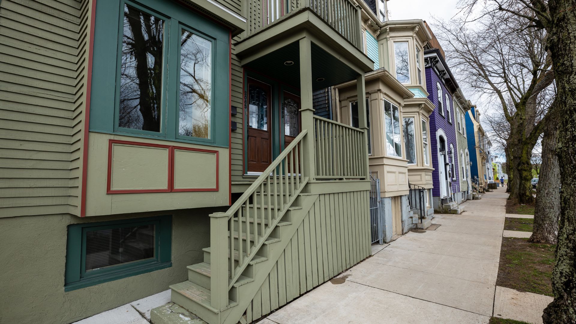Halifax housing market_colourful front doors lining sidewalk